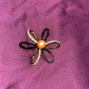 Costume Jewelry Floral Brooch with Faux Pearl Center and Rhinestone Accents.